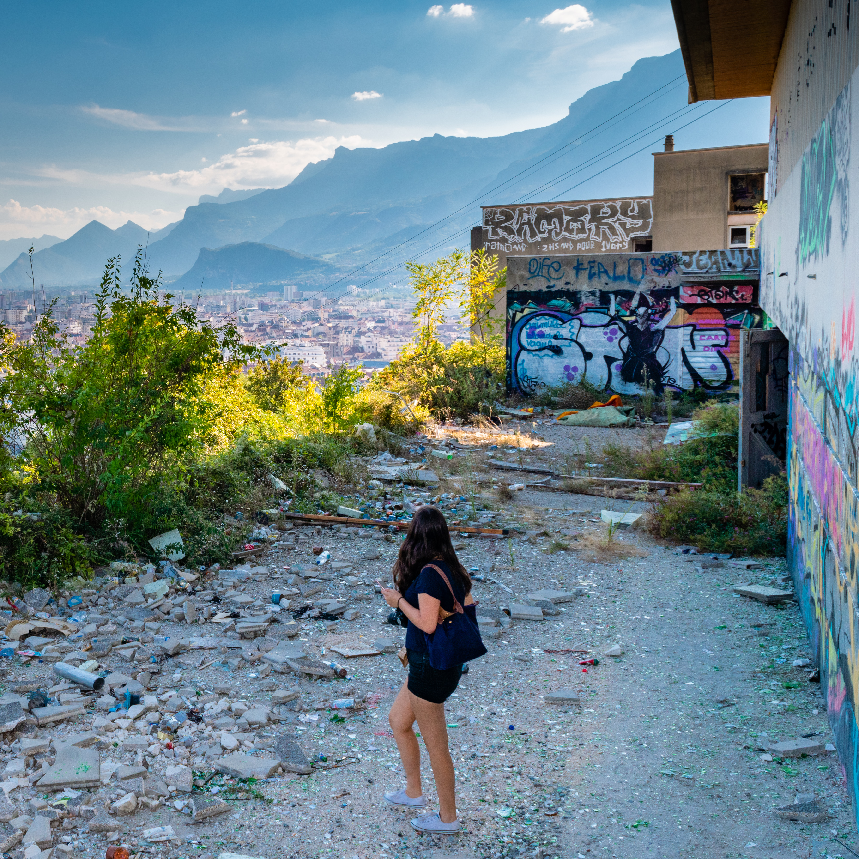 Woam Overlooks French Alps from Abandoned College Campus covered in Grafiti