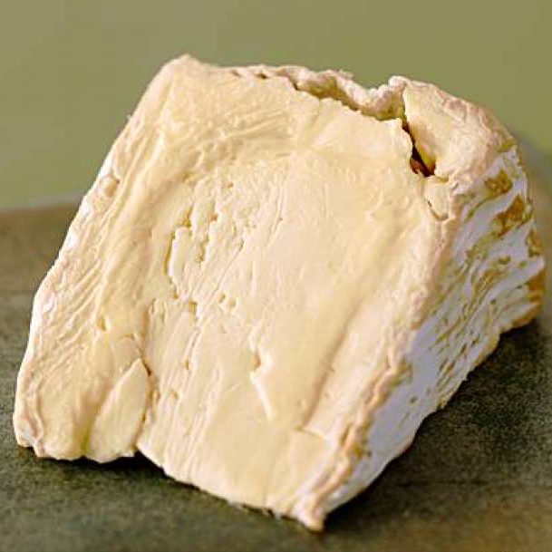 A slice of delice de bourgogne cheese.